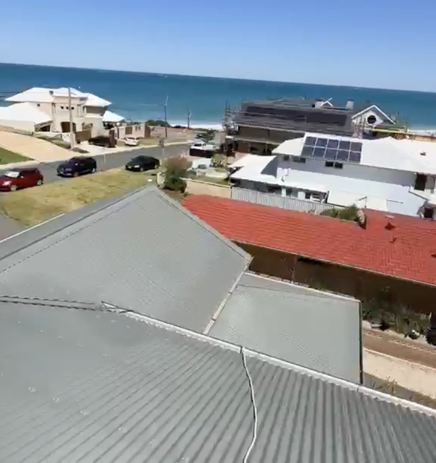 Colorbond metal roof painting Perth — coastal suburb aerial view